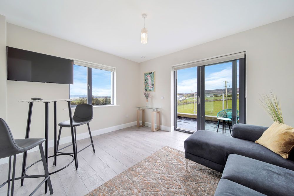 Upper floor living area with double doors to balcony